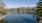 a body of water with apartments along it