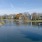 a body of water with apartments along it