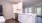 a kitchen with white cabinets