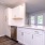 a kitchen with white cabinets