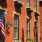 a flag on a brick building