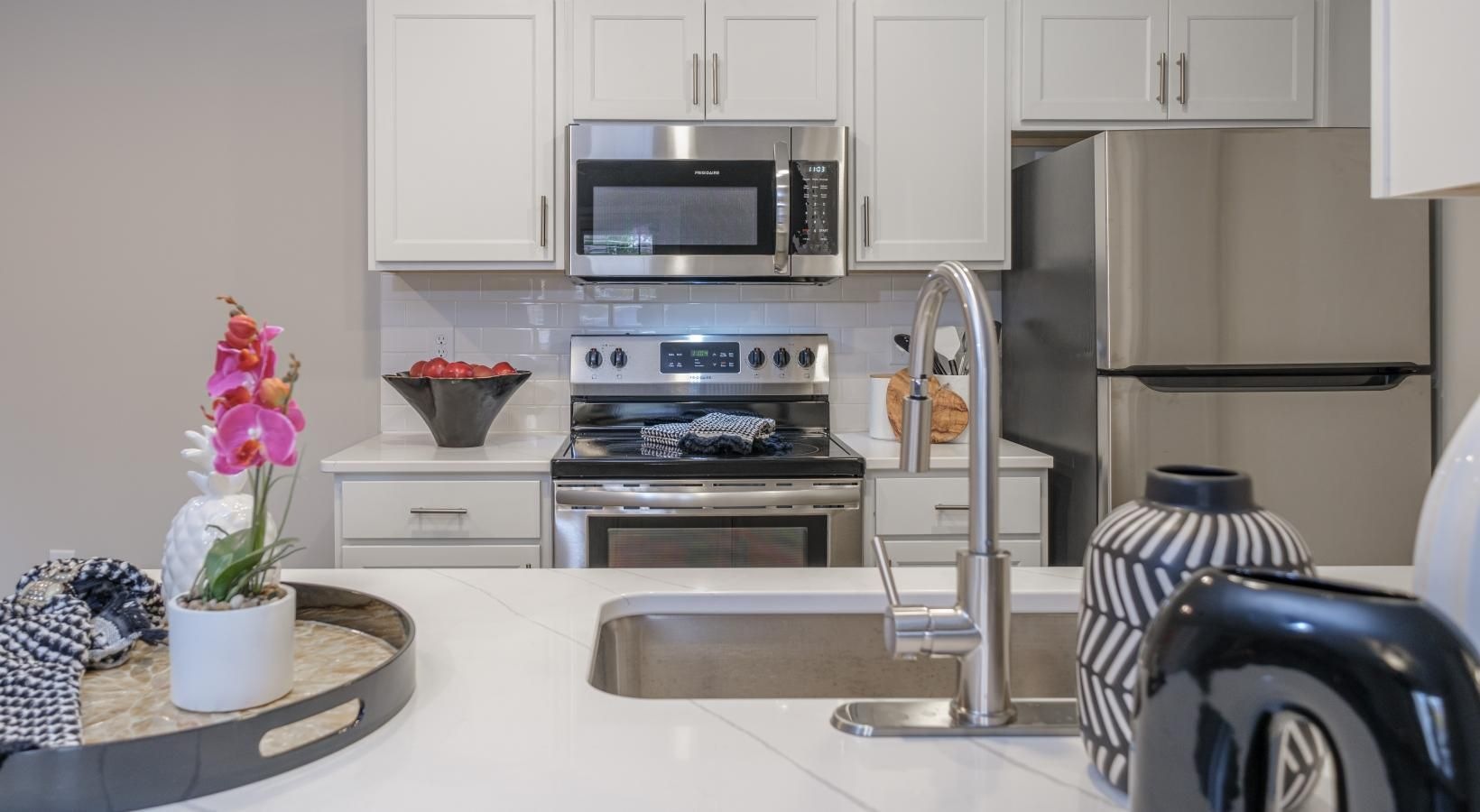 Gorgeous living areas to entertain and enjoy a kitchen with white cabinets