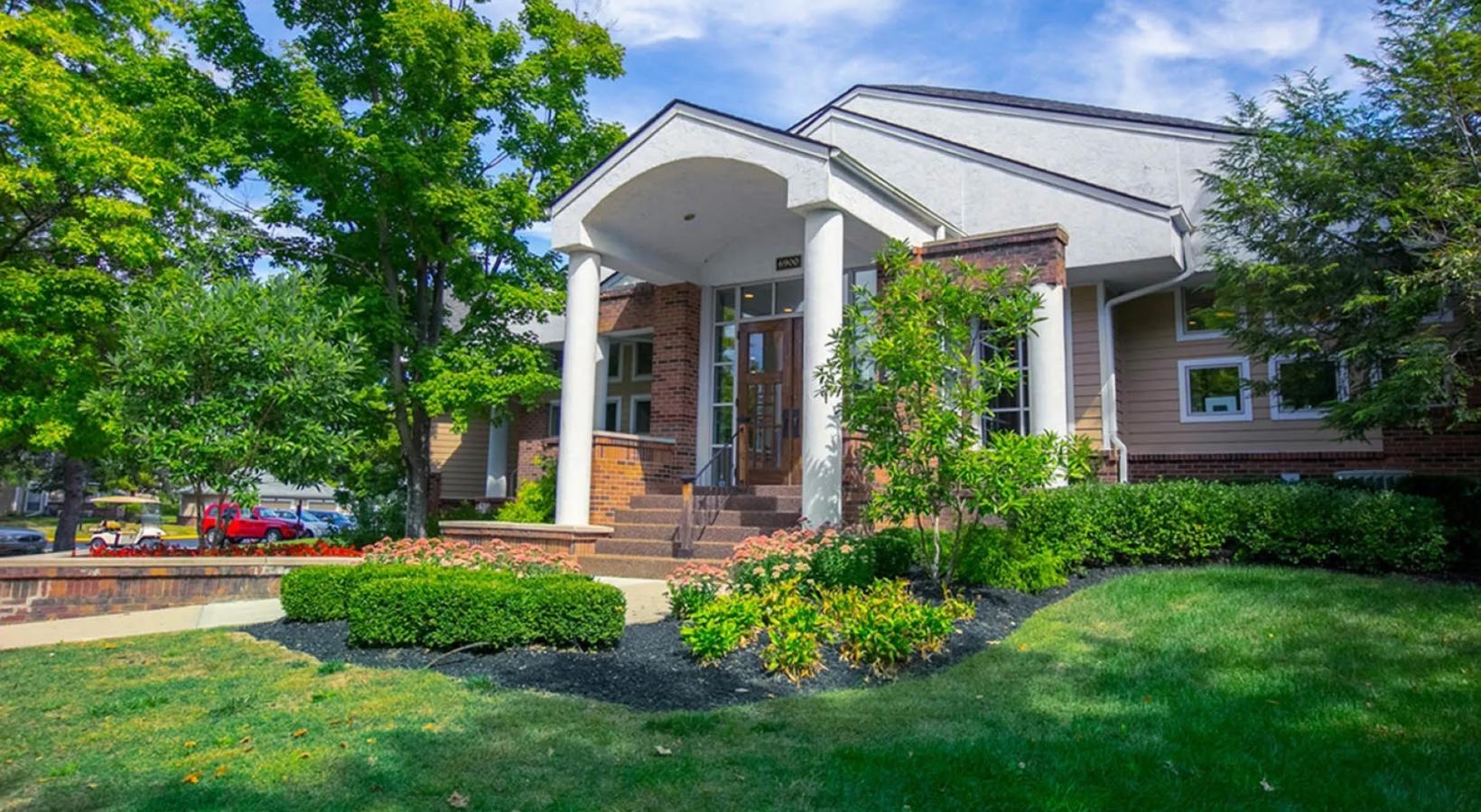 Settle into comfort at Saw Mill Village a building with a large front yard