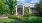 a building with a large front yard
