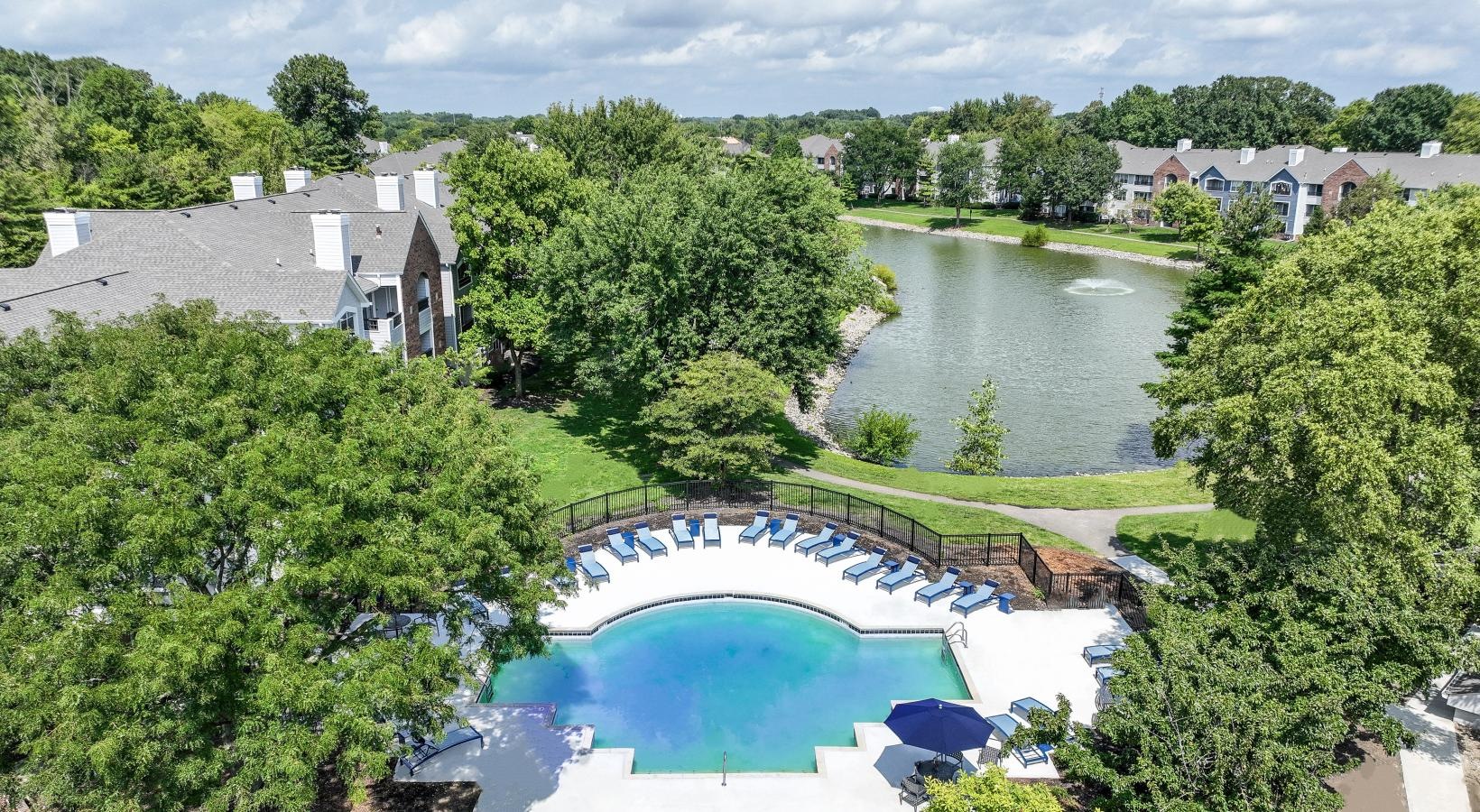 The essence of exceptional living a large swimming pool surrounded by trees