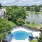 a large swimming pool surrounded by trees