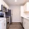 a kitchen with white cabinets