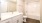 a bathroom with a tub, sink, and toilet
