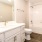a bathroom with a tub, sink, and toilet