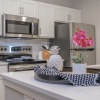 kitchen with sink and counter with flowers on a table