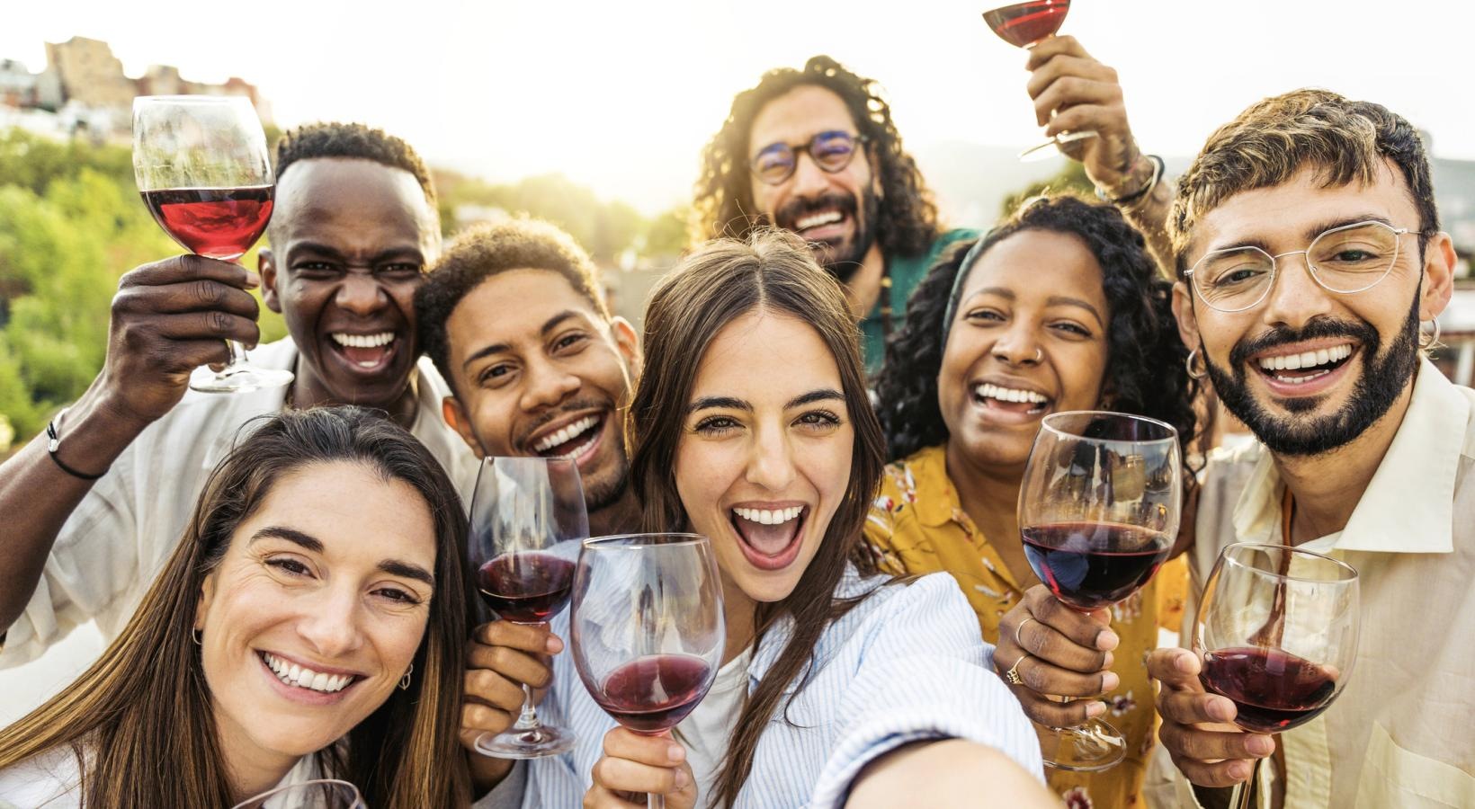 The essence of exceptional living a group of people holding wine glasses
