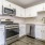 a kitchen with white cabinets