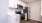 a kitchen with white cabinets