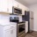 a kitchen with white cabinets