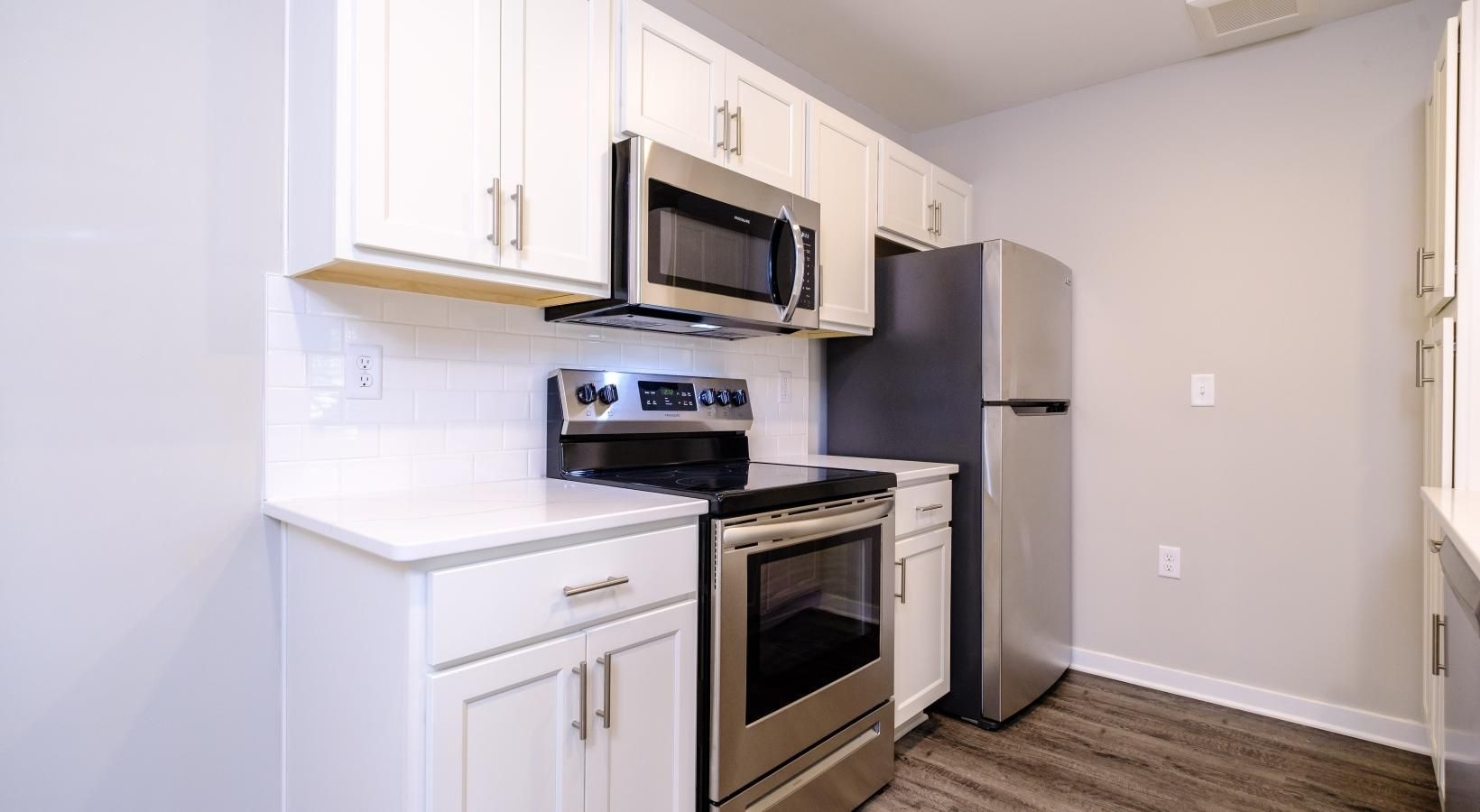 Spacious kitchens with thoughtful details a kitchen with white cabinets