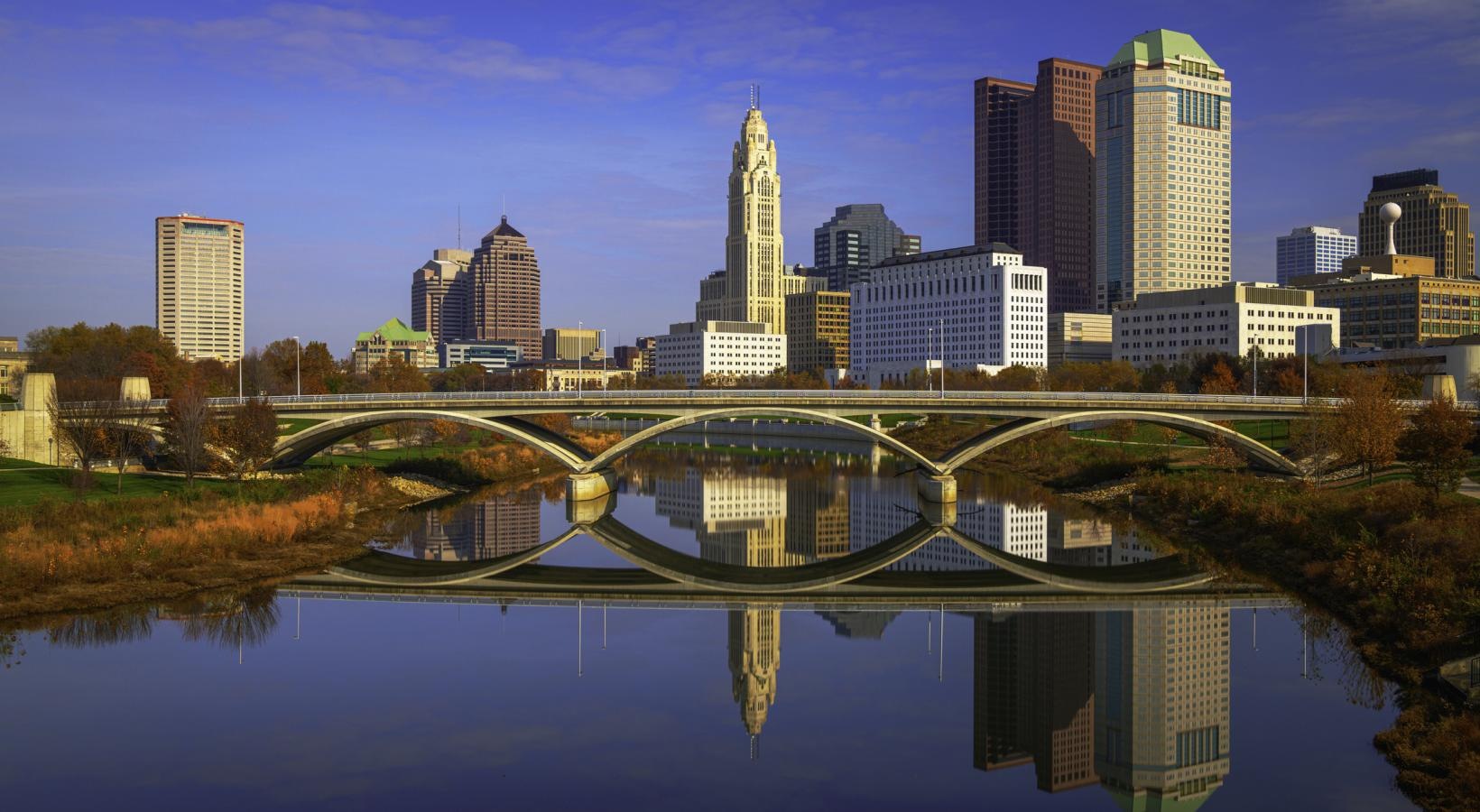 Find your perfect fit at Saw Mill Village a city skyline with a bridge over a body of water