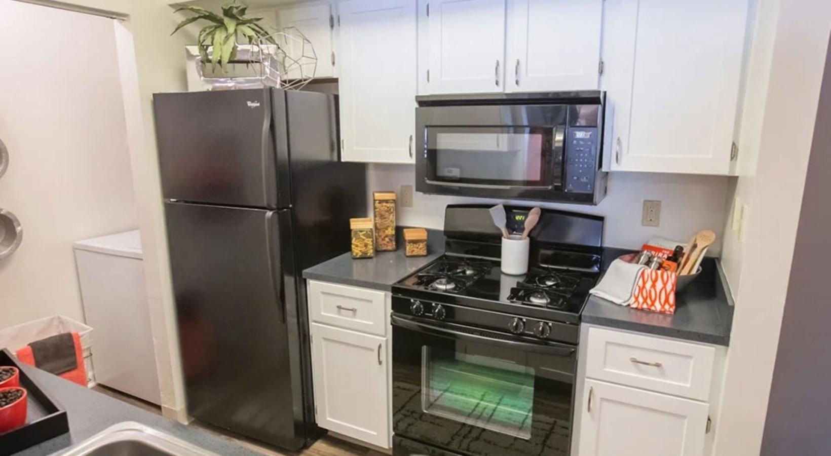 Spacious kitchens with thoughtful details a kitchen with white cabinets