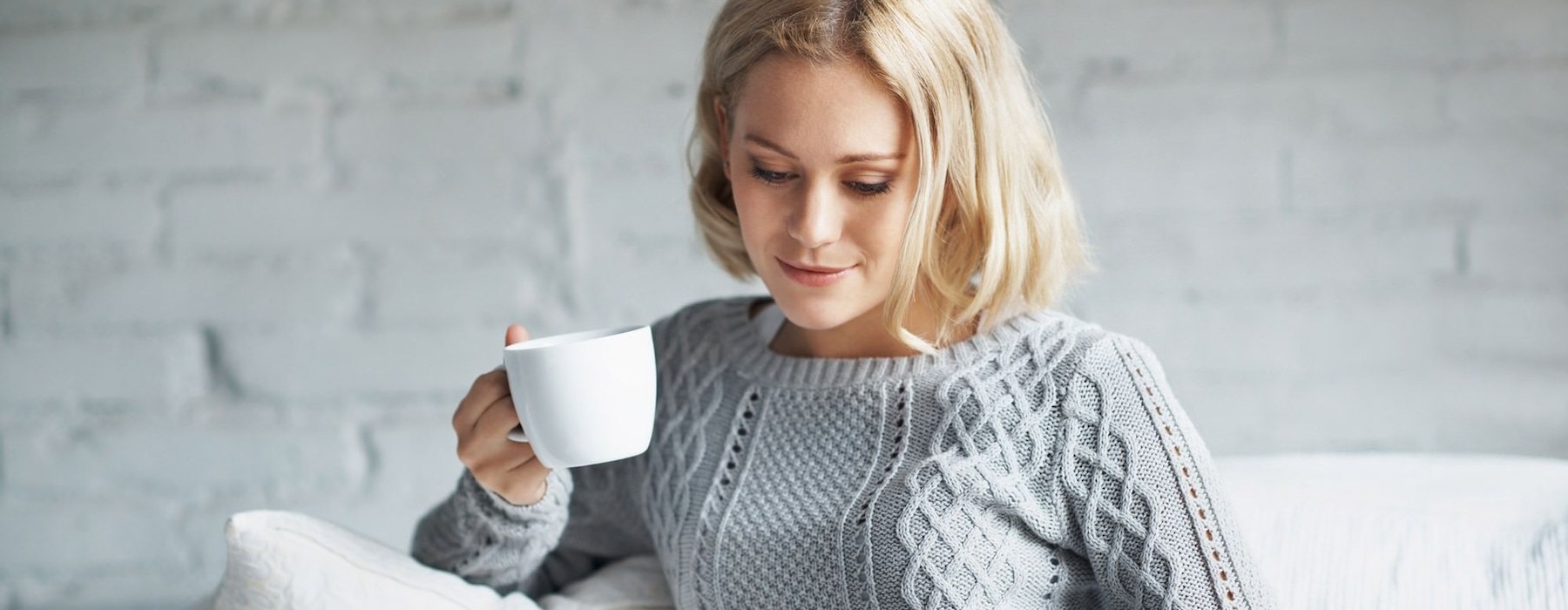 woman holding a cup of coffee