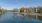 a body of water with apartments along it