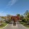 a road with trees and buildings along it