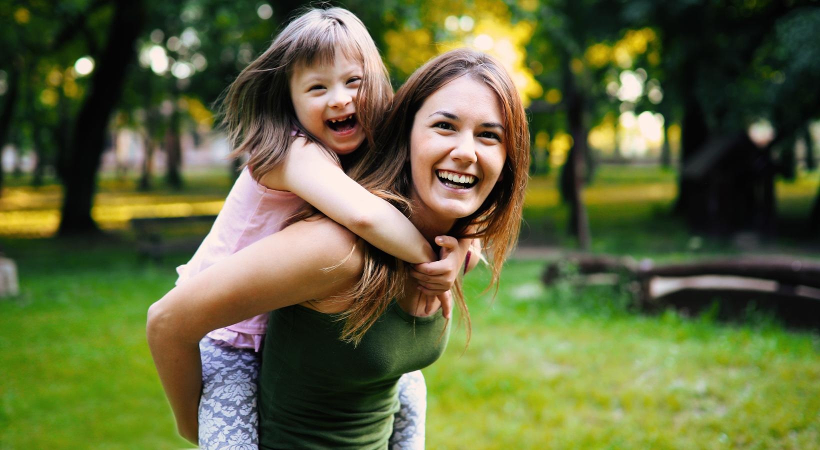 Settle into comfort at Saw Mill Village a woman holding a child
