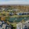 a group of apartments next to a body of water