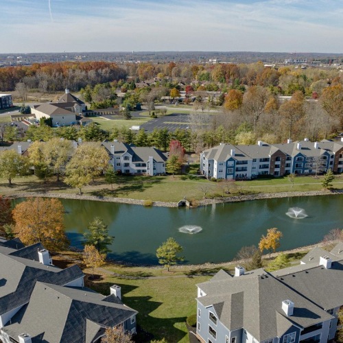 The essence of exceptional living a group of apartments next to a body of water