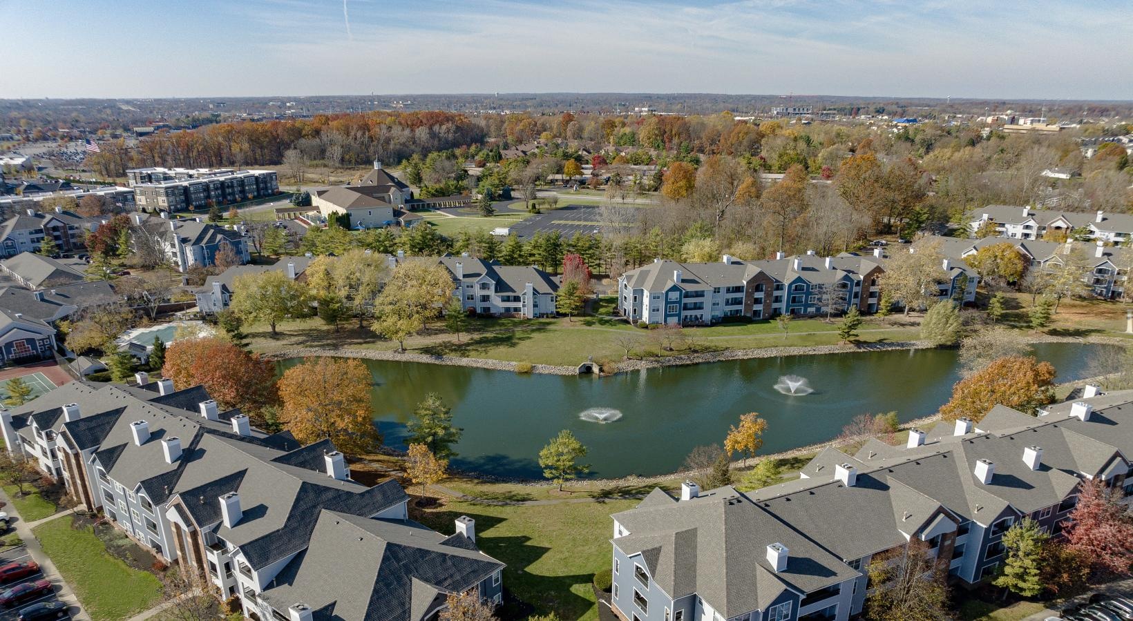 The essence of exceptional living a group of apartments next to a body of water